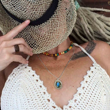 woman wearing labradorite necklace