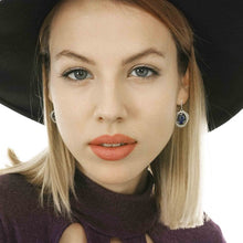 woman wearing labradorite earrings