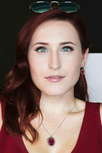 Woman wearing amethyst jewelry set