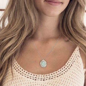 Woman wearing Aquamarine Necklace