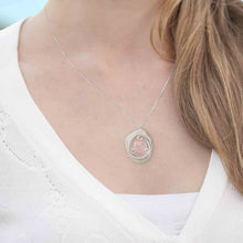 woman wearing morganite jewelry necklace earring set