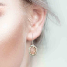 woman wearing morganite earrings