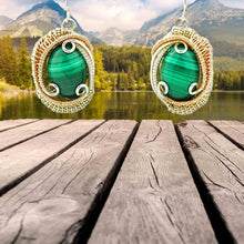 malachite wire wrapped silver and rose gold earrings in a lake