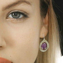 woman wearing lepidolite earring